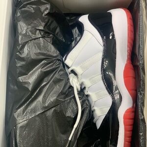 White and Black Sneakers with Red Soles